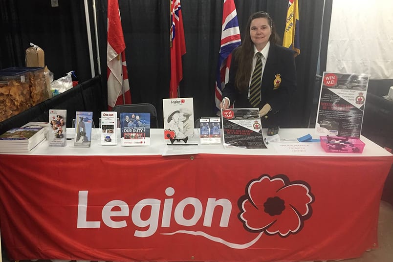 Girl showing pamphlet at event